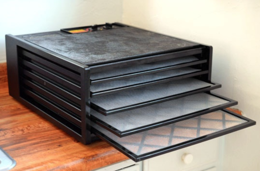 The smaller, 5-tray model without any food in it